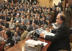 Katatni of the Muslim Brotherhood speaks to other members of parliament during the first Egyptian parliament session in Cairo البرلمان المصرى