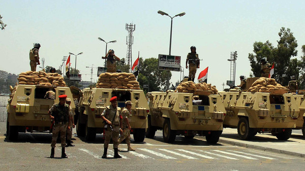 قوات الجيش تصل إلى محافظة الشرقية لتأمين اللجان الانتخابية 1 Egyptian Army armoured vehicles sit parked at a checkpoint in the district of Nasser City the morning after former Egyptian President Mohammed Morsi, the country's first democratically elected president, was ousted from power on July 4, 2013 in Cairo, Egypt. Adly Mansour, chief justice of the Supreme Constitutional Court, was sworn in as the interim head of state in ceremony in Cairo in the morning of July 4, the day after Morsi was placed under house arrest by the Egyptian military and the Constitution was suspended. UPI/Ahmed Jomaa