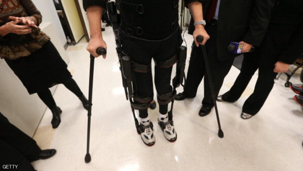 NEW YORK, NY - DECEMBER 06:  Forty three-year-old parapalegic Robert Woo stands while walking with an exoskeleton device made by Ekso Bionics during a demonstration at the opening of the Rehabilitation Bionics Program at Mount Sinai Rehabilitation Center on December 6, 2012 in New York City. Woo is an architect who was paralyzed from the hips down during a construction accident and thought he would never walk again. The new strap-on exoskelton uses motors and sensors to physically move the legs.  (Photo by Mario Tama/Getty Images)