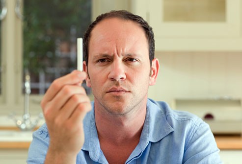 getty_rf_photo_of_balding_man_holding_cigarette