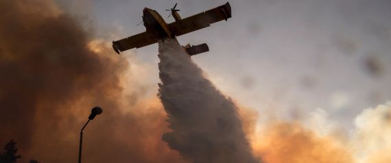  Hundreds of Israelis fled their homes on the outskirts of the country's third city Haifa with others trapped inside as firefighters struggled to control raging bushfires, officials said. / AFP / JACK GUEZ (Photo credit should read JACK GUEZ/AFP/Getty Images)