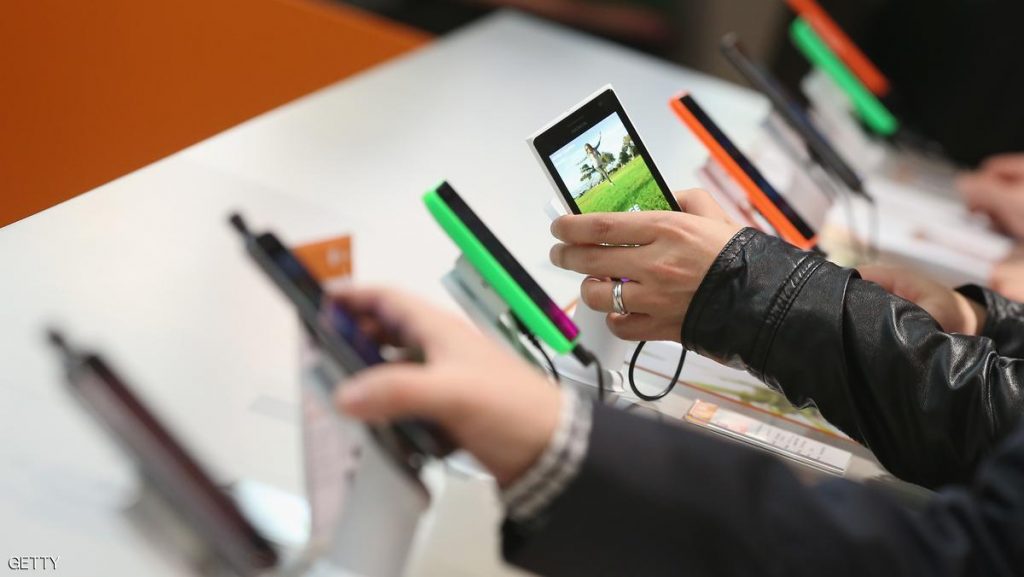 HANOVER, GERMANY - MARCH 16: Visitors look at Windows-enabled smartphones, including the Nokia Lumia series, at the Microsoft stand the 2015 CeBIT technology trade fair on March 16, 2015 in Hanover, Germany. China is this year's CeBIT partner. CeBIT is the world's largest tech fair and will be open from March 16 through March 20. (Photo by Sean Gallup/Getty Images)
